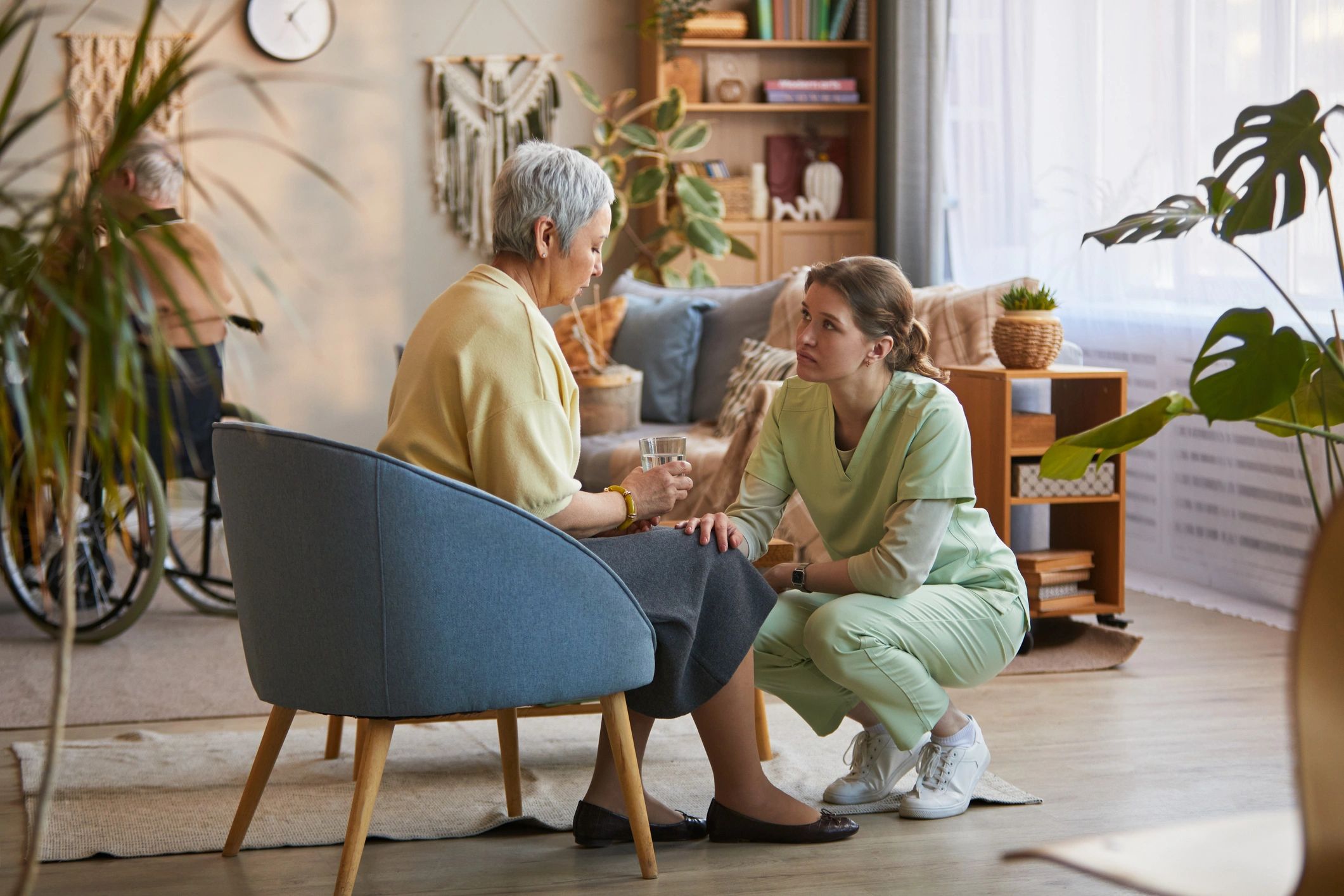 Senior woman speaking with a caregiver